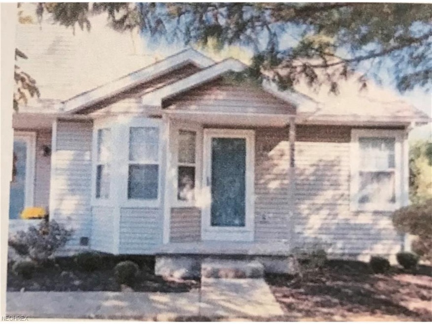 FRONT VIEW WITH WALKWAY LEADING TO FRONT DOOR AND 