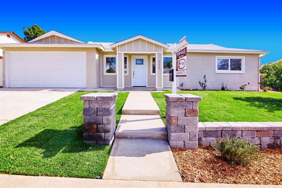 Freshly Landscaped with sod (grass) and Stone Wall