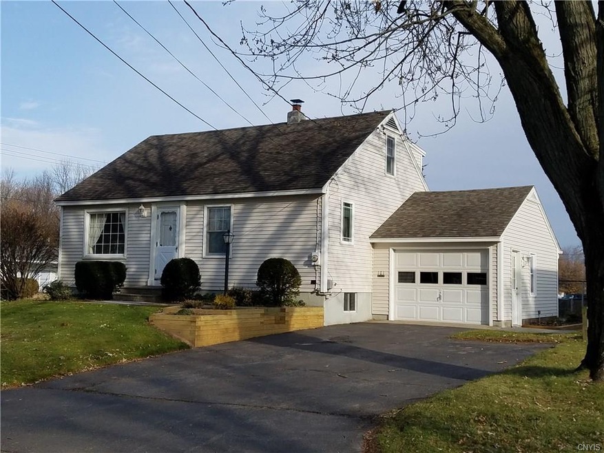 Nicely maintained Cape Cod with vinyl siding and M