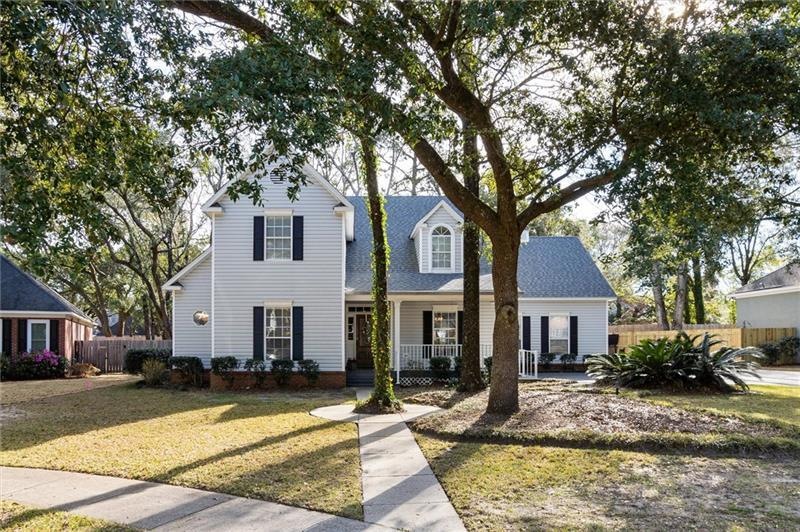 Nestled beneath beautiful oaks in one of the best 