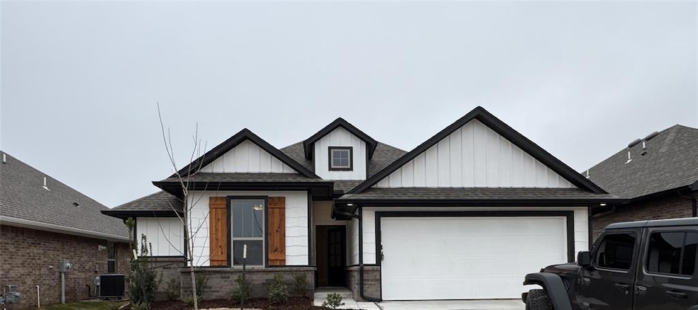 Modern inspired farmhouse featuring roof with shingles, an attached garage, board and batten siding, and driveway