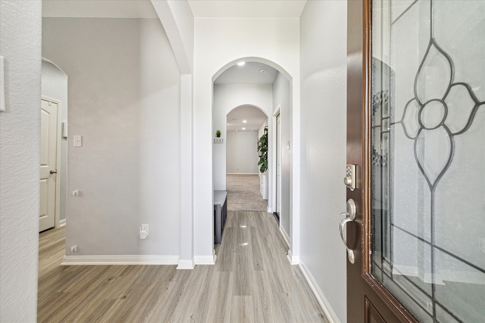 Proudly enter your beautiful, nearly new home!!