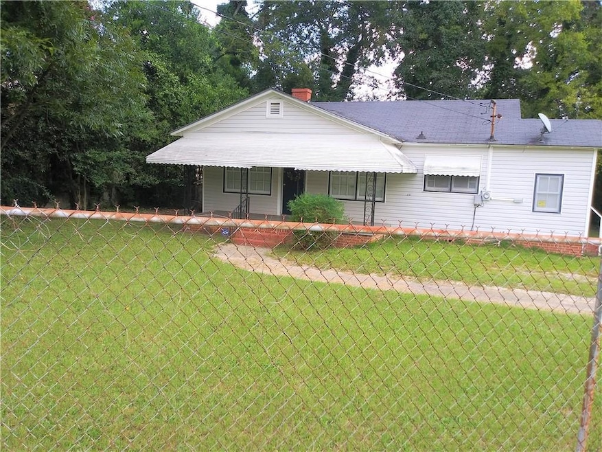 View of front of property with a chimney