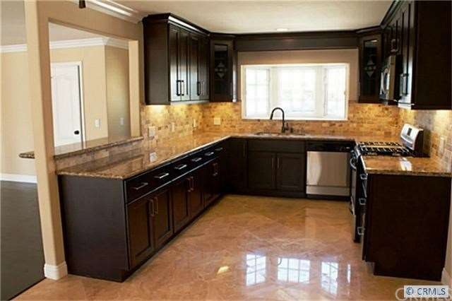 granite counters.tumbled travertine back splash,ne