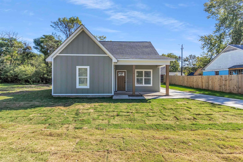 View of front of property featuring covered porch, board and batten siding, and a shingled roof