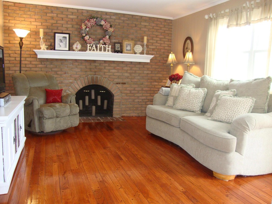 FAMILY ROOM w EXPOSED BRICK WALL