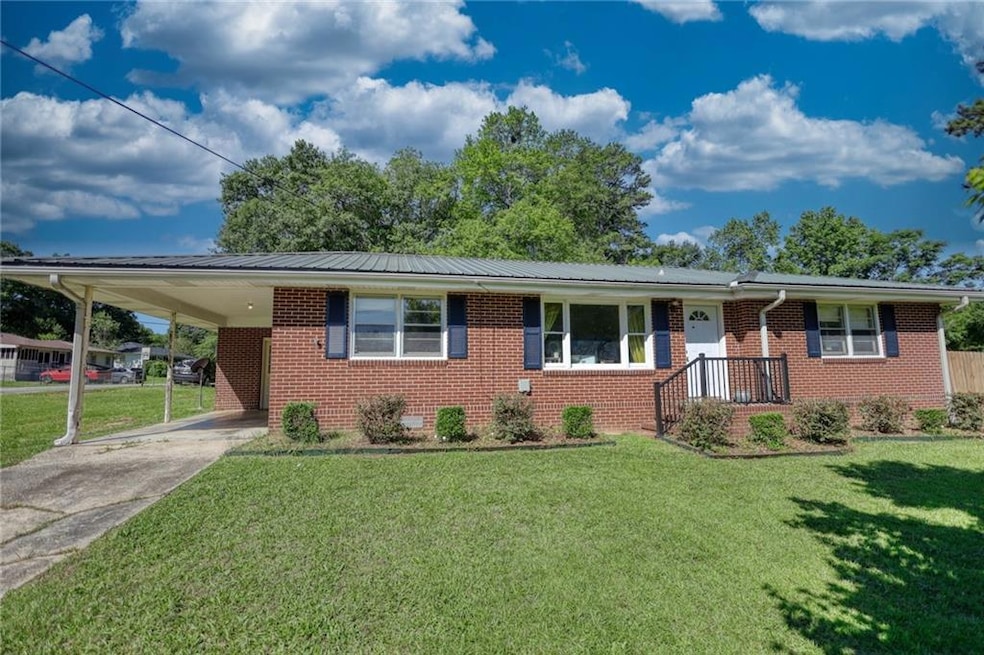 View of front of house with a carport and a front 