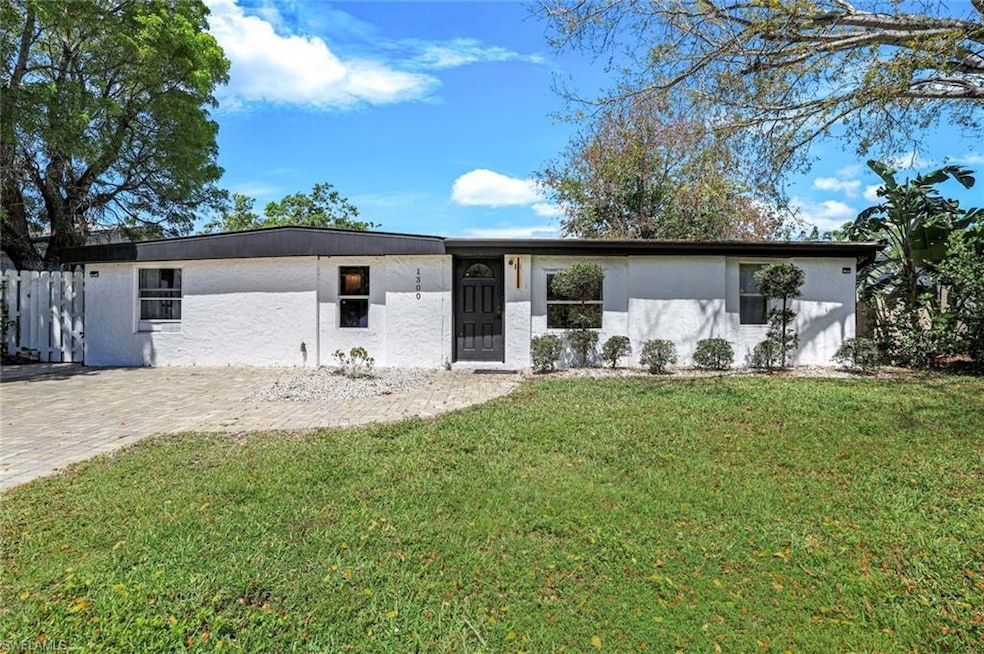 View of front of house with stucco siding and a fr