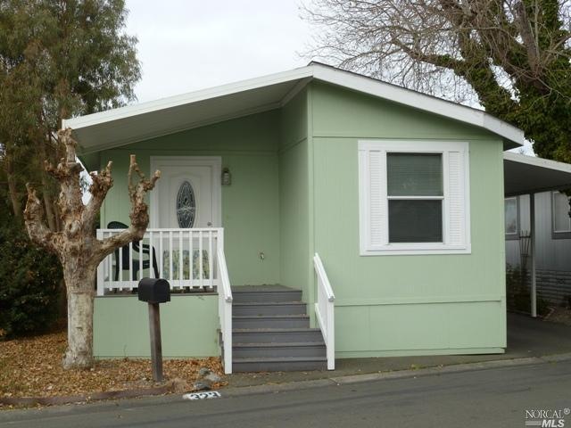 Charming entry porch offers a gracious space in which to greet your guests.  There's guest parking right across the street.