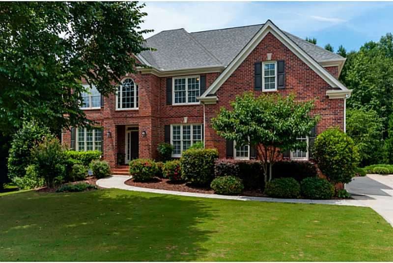 Exterior Front. Three sided brick beauty on quiet,