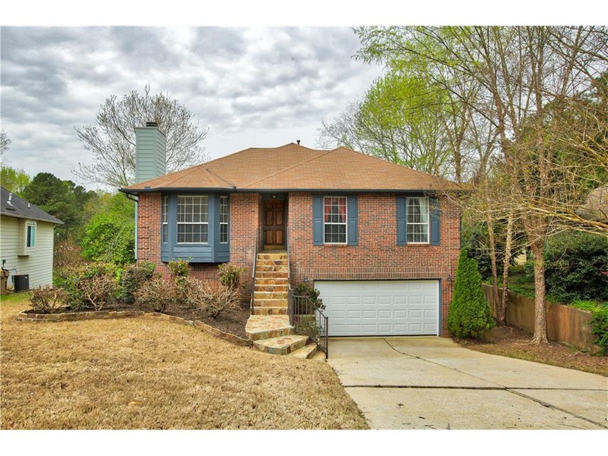 Brick front, Stone stairway & covered entry for lo