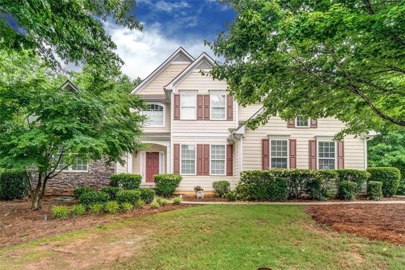 AMAZING FOUR BEDROOM HOME ON 1/2 ACRE IN THE SWIM/
