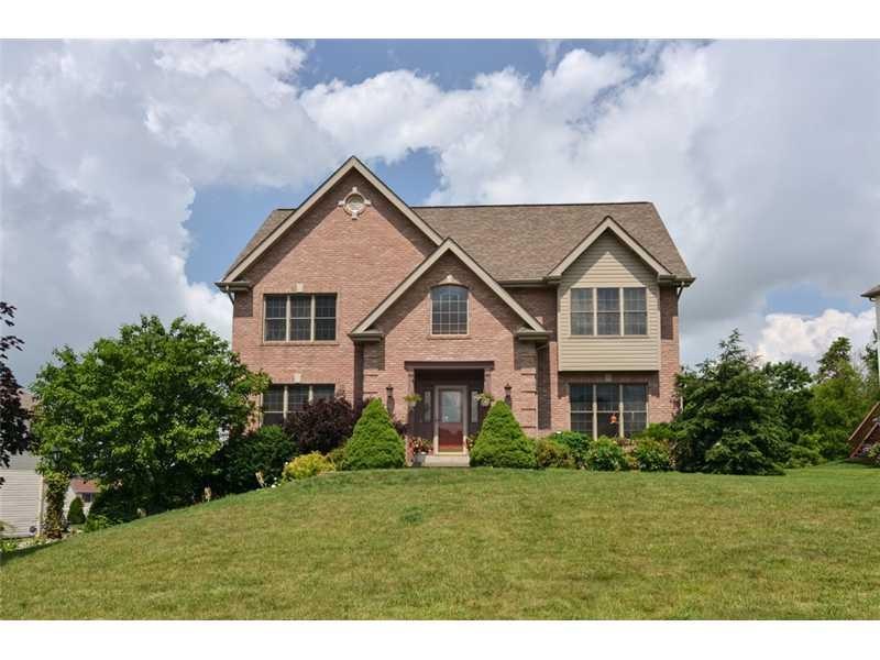 Exterior Front. This lovely custom built home boasts quoined corners at the entry, a lovely landscaped yard that has a mostly level tree lined back yard, and fabulous private concrete patio.
