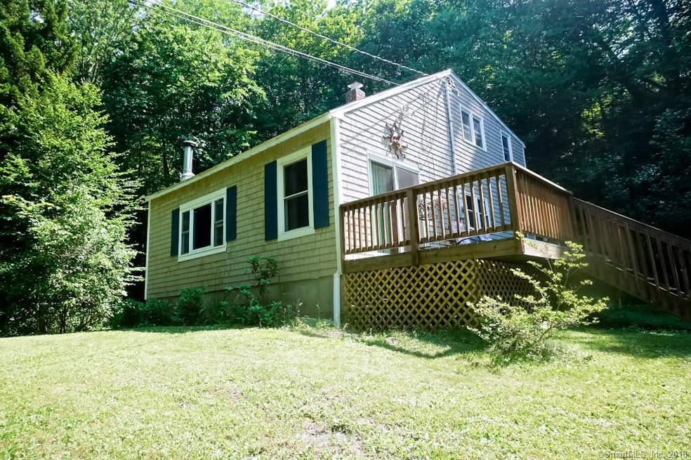 Front and side exterior shows large deck off livin