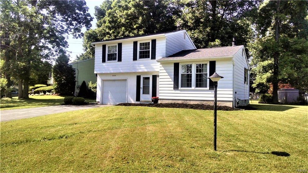 Front of home with all new vinyl shutters and Comf