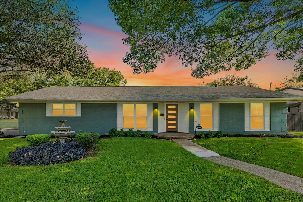 View of front of home featuring brick siding, a f