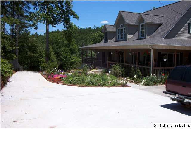 Front of home with concrete drive.