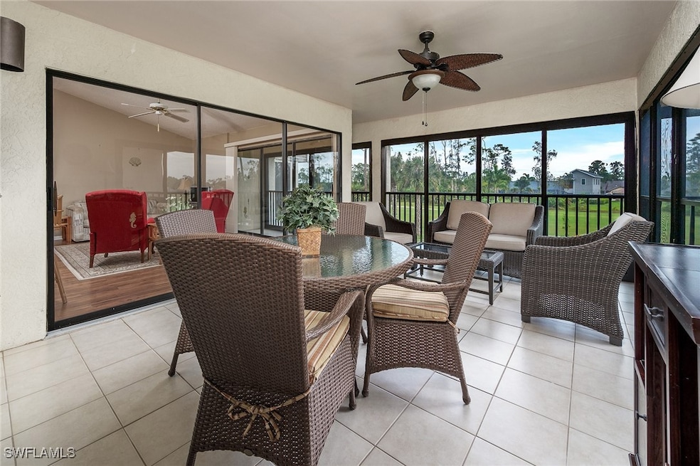 Sunroom / solarium featuring lofted ceiling and ce
