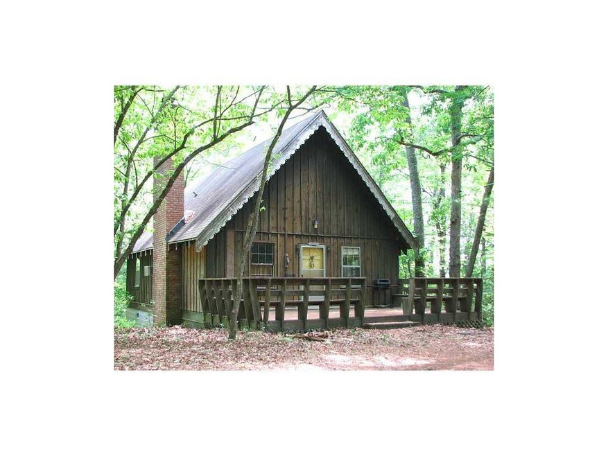 Exterior Front. Authentic board and batten mountai