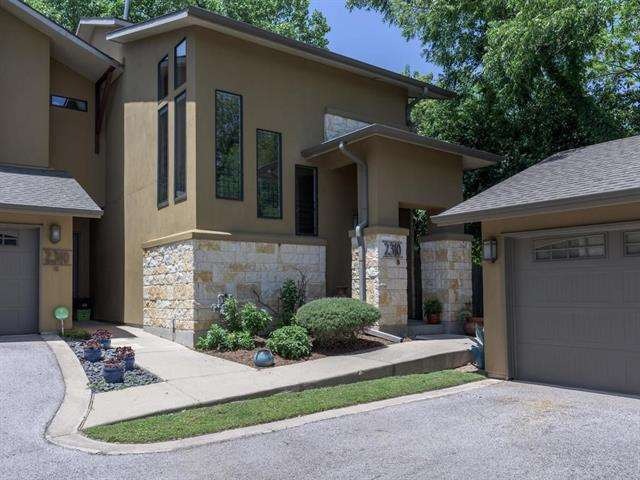 Corner unit with 2 car detached garage on the right