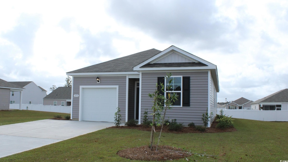 Ranch-style home featuring concrete driveway, an attached garage, and a shingled roof