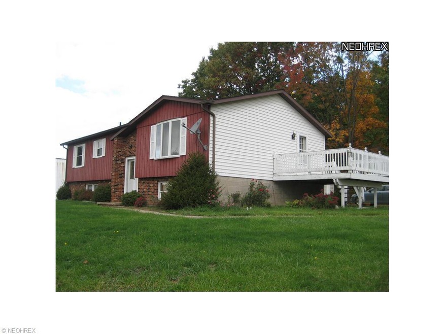 4 bedroom 2 bath bi-level overlooking the 7.9 +/- 
