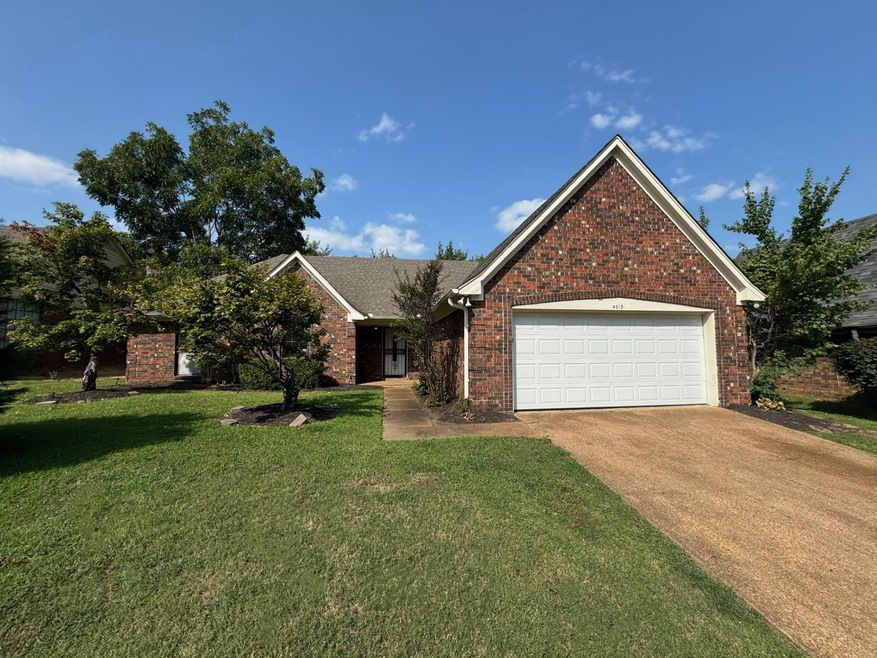 View of front facade with a garage and a front law