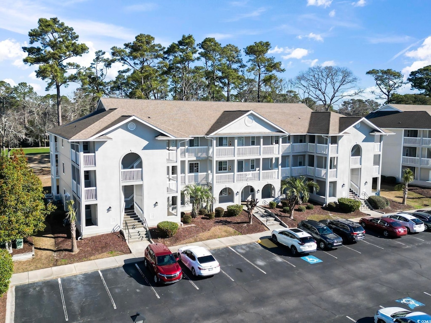 View of building exterior featuring stairs and unc