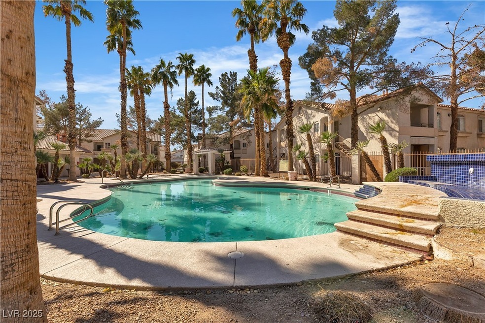 Community pool featuring a residential view, fence