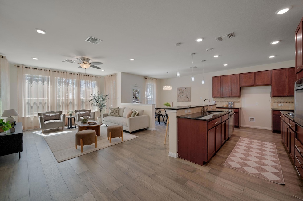 Kitchen with open floor plan, light wood-type flo