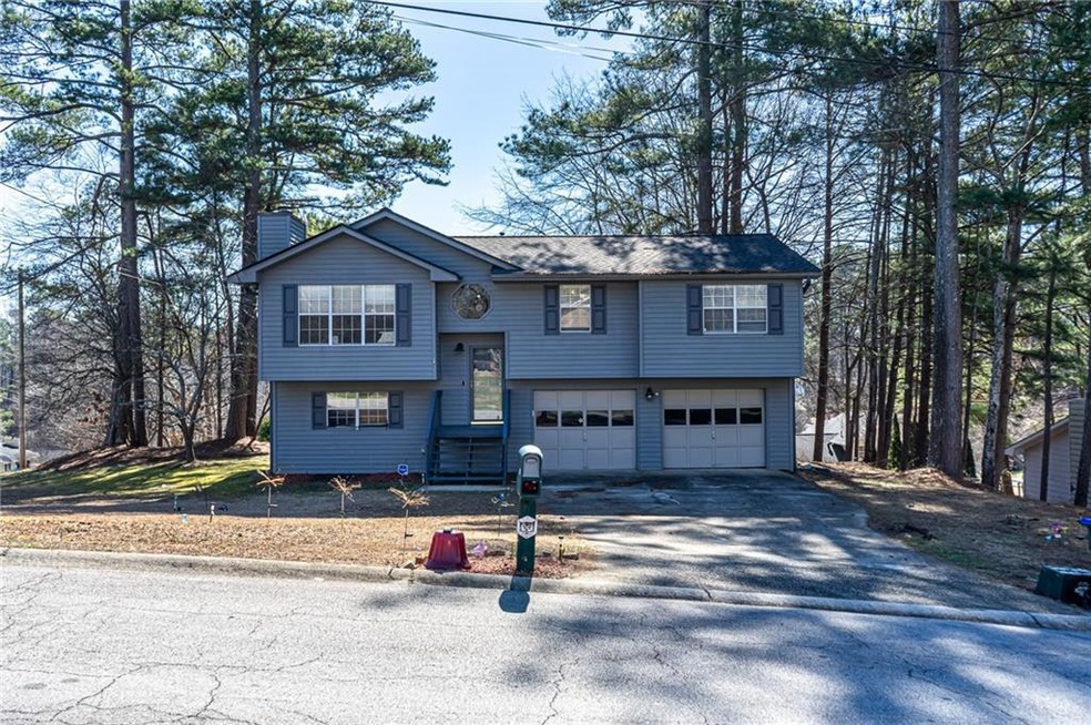 Split foyer home featuring a garage
