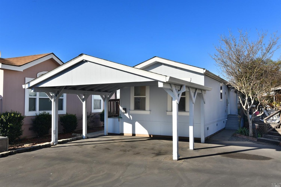 Front of the home with 2-car carport