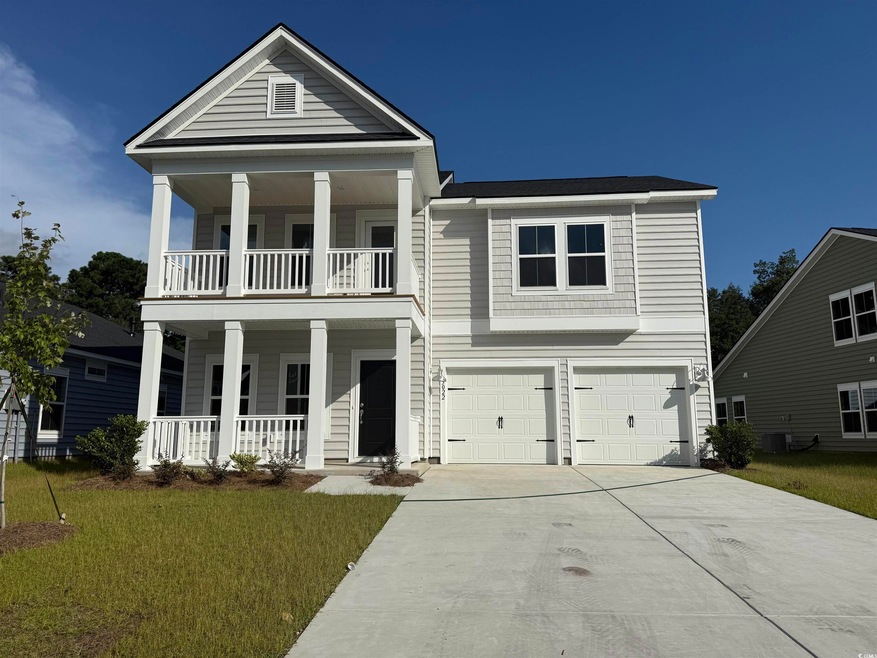 Neoclassical / greek revival house featuring a porch, a front yard, concrete driveway, and an attached garage