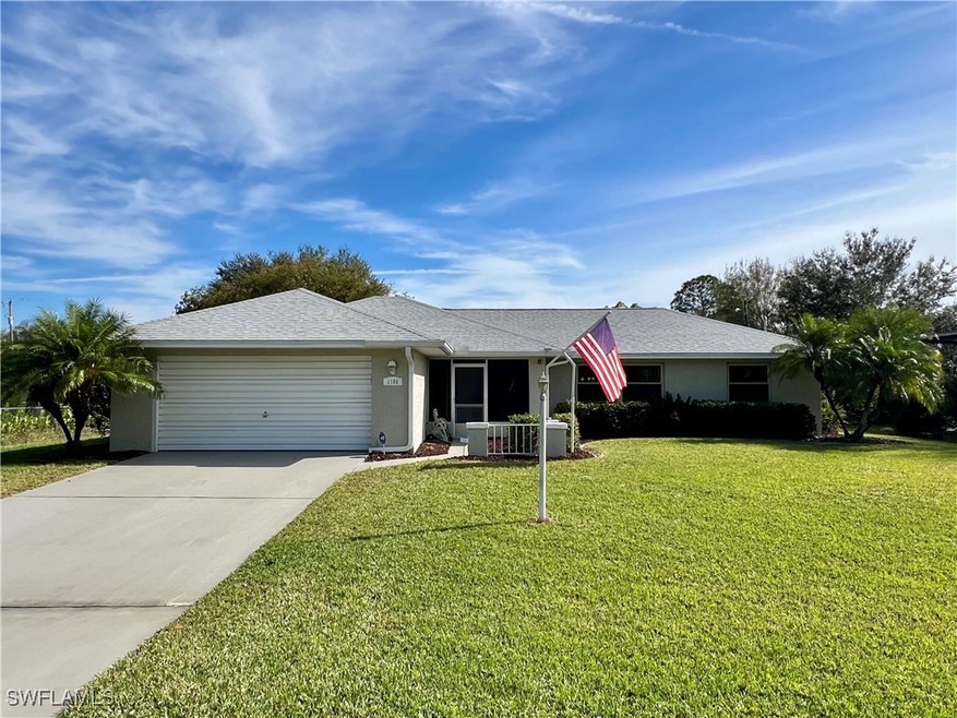 Single story home with garage, and a front yard