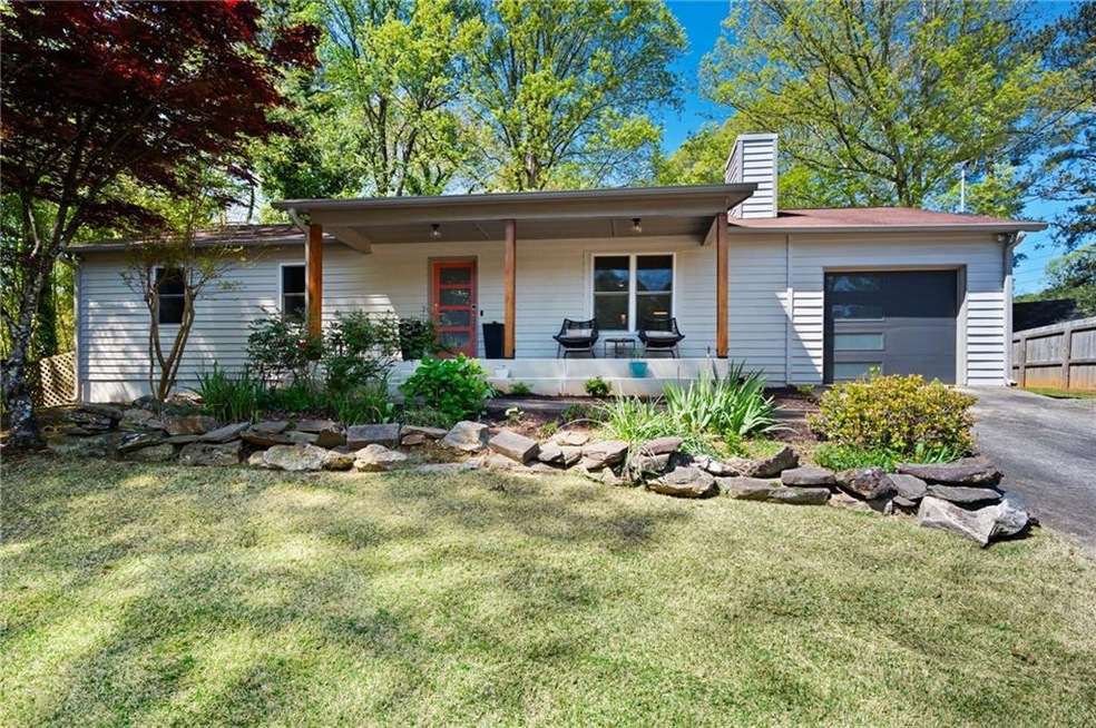Ranch-style home featuring a front lawn, covered p