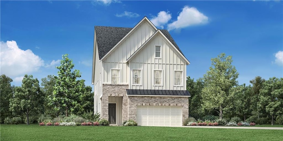 View of front of property with a garage and a fron