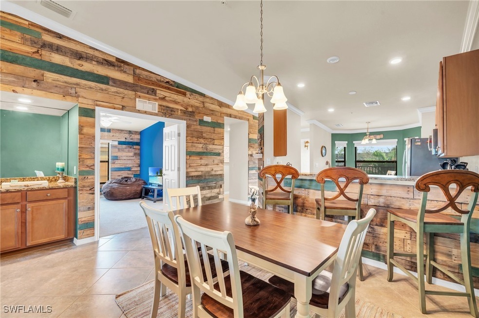 Tiled dining room with crown molding