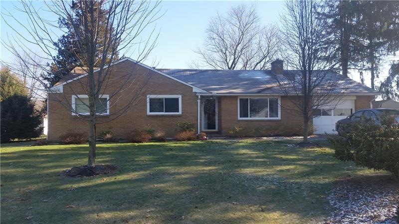 Front of all brick home on level lot