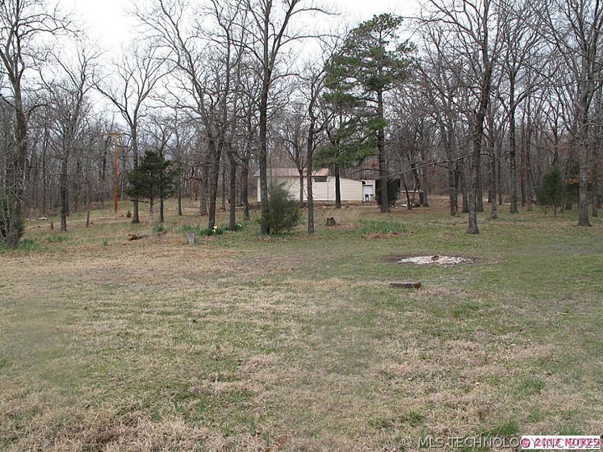 Garage sits in middle of 2 acres more or less