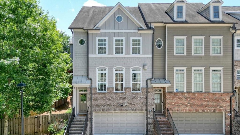Townhome / multi-family property with a garage, br
