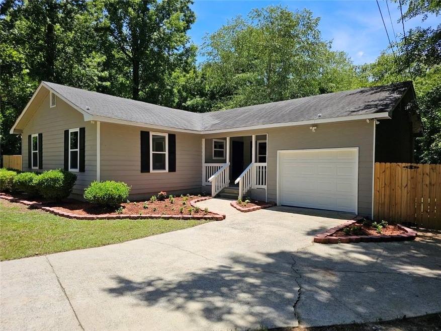 Single story home featuring a garage