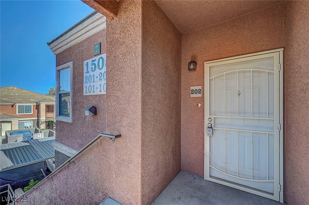 Entrance to property with stucco siding