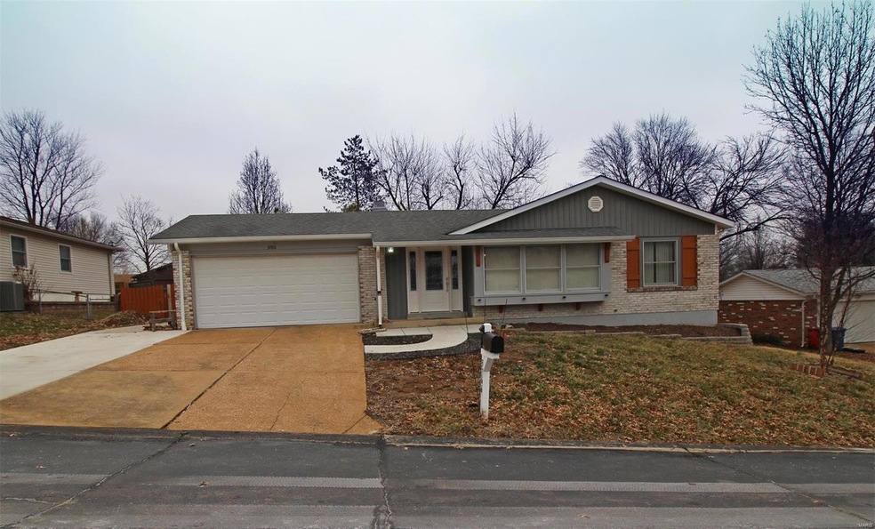 Front of house with 3rd car driveway