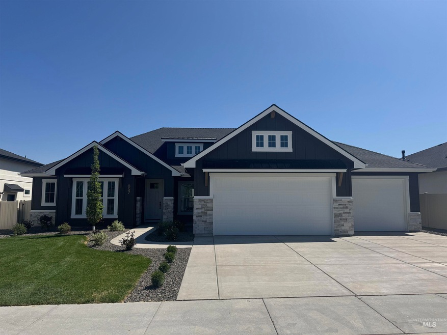 Craftsman house featuring driveway, a front yard, stone siding, and an attached garage