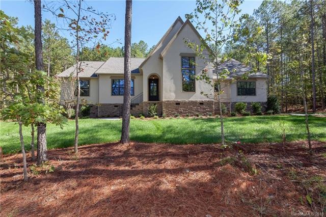 This gorgeous home is located on a stunning wooded