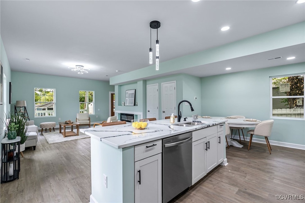 Kitchen featuring sink, stainless steel dishwasher