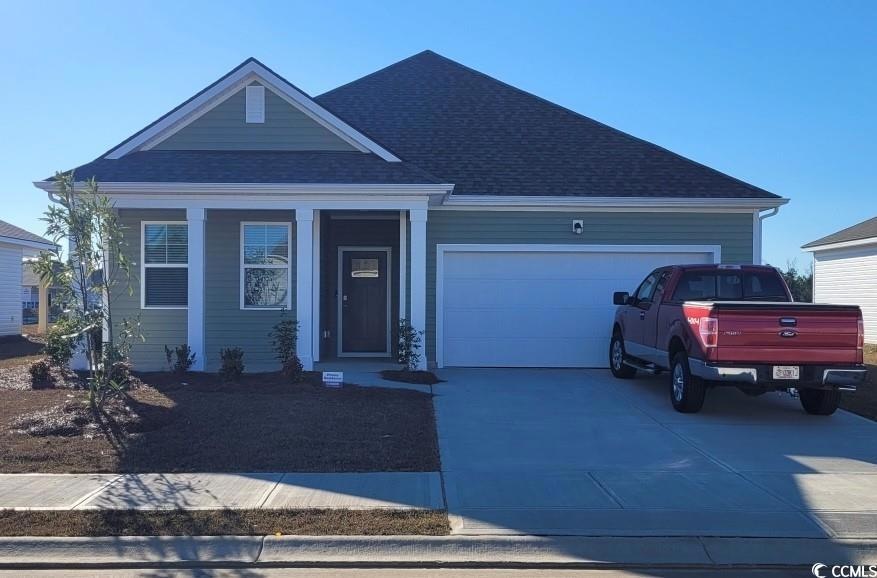 View of front of property with a garage