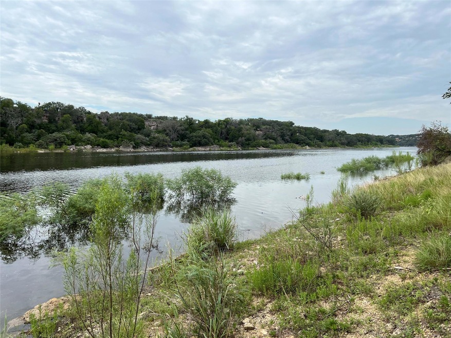 Water view featuring a forest