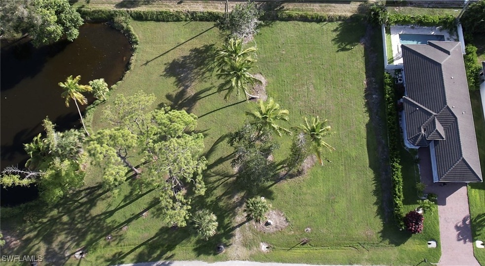 Aerial view of property's location featuring a nearby body of water