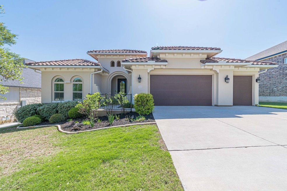 Mediterranean / spanish-style house with an attac